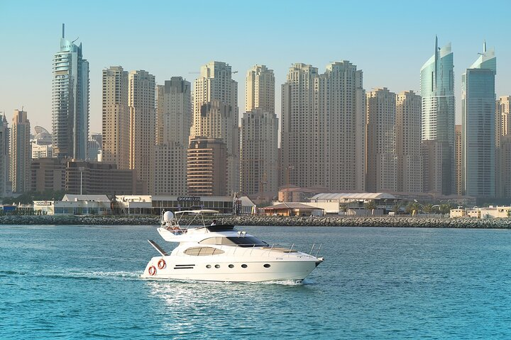 Sail past stunning skyscrapers and experience Dubai's luxurious waterfront. Discover top attractions effortlessly while enjoying the sun-soaked views from your comfortable vessel. A perfect blend of leisure and exploration awaits!